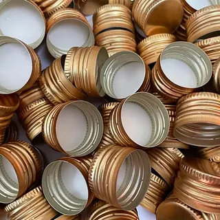 Anodised gold aluminium ROPP caps manufactured by GSR Metal Caps, 22 mm range