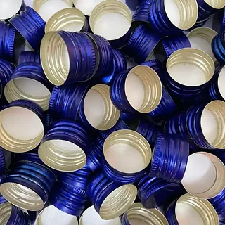 Blue colour-coated aluminium ROPP caps manufactured by GSR Metal Caps, 25 mm range