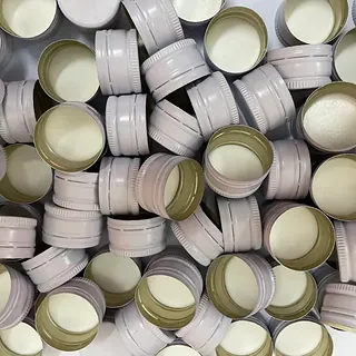 White aluminium ROPP caps manufactured by GSR Metal Caps, 28 mm range
